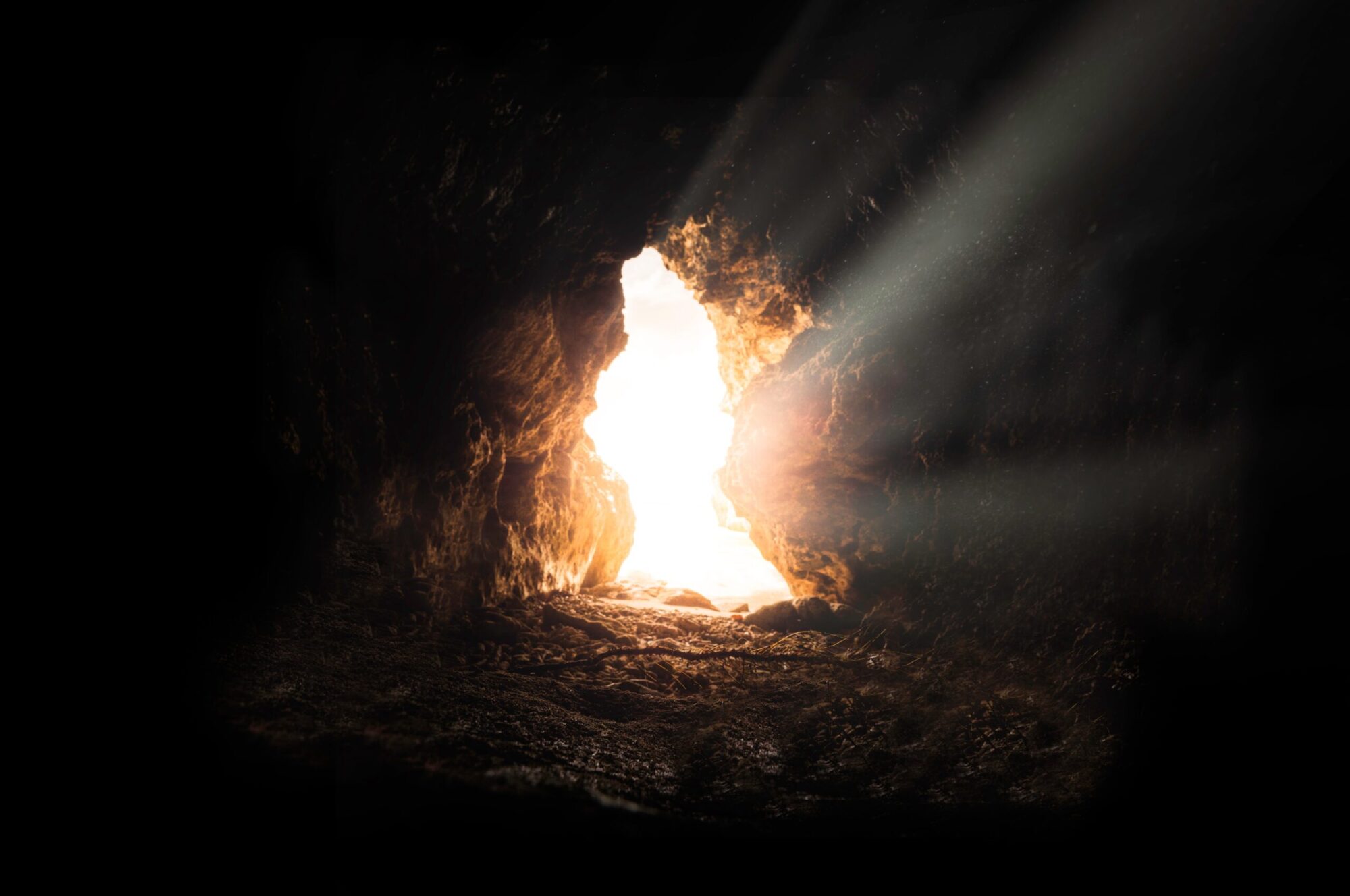 Strong and bright light enters through the cave's opening.