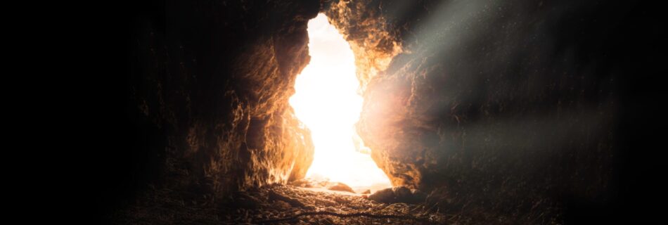 Strong and bright light enters through the cave's opening.