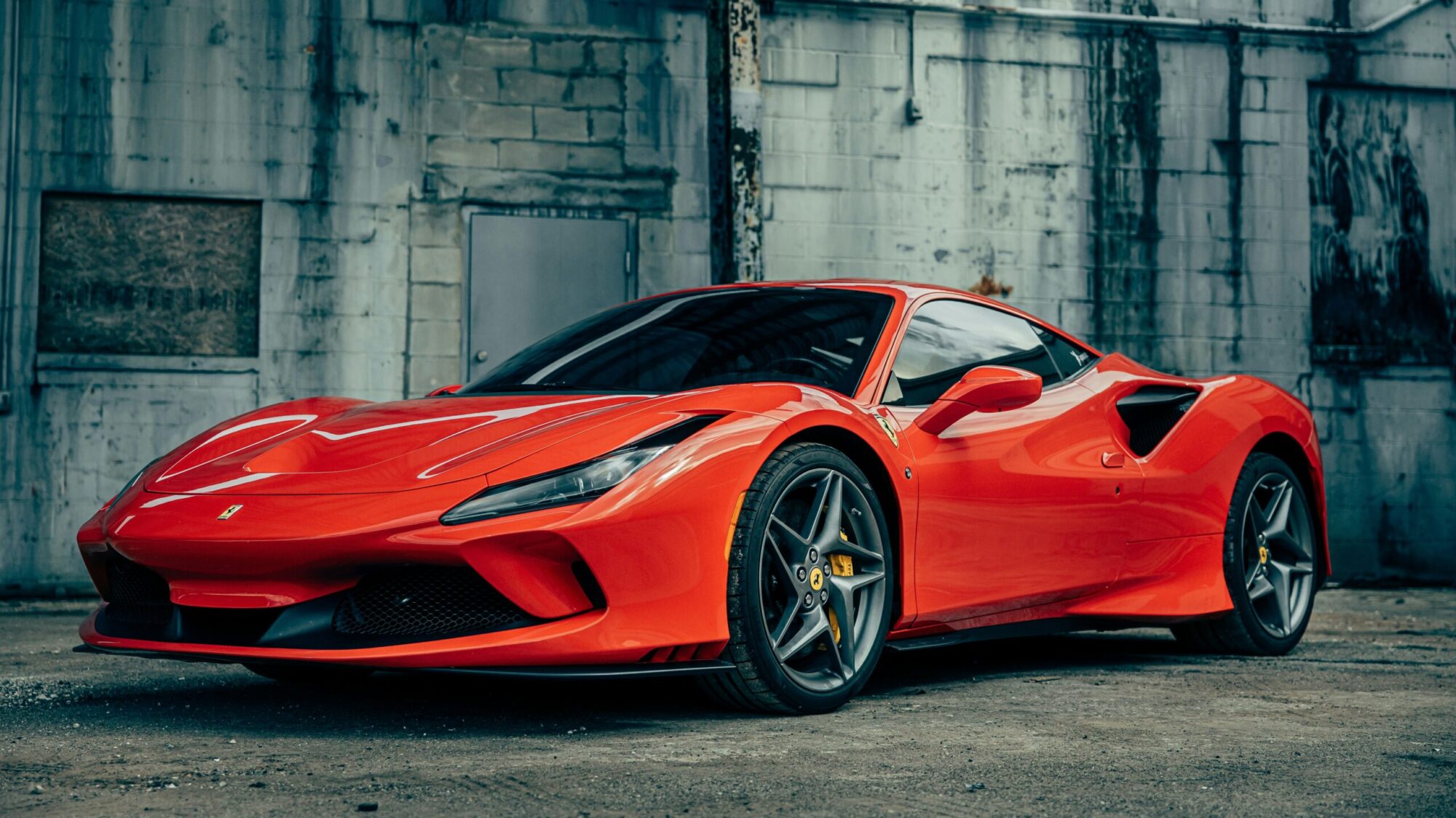 Red Ferrari against grey background