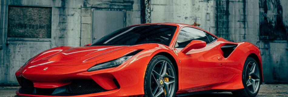 Red Ferrari against grey background